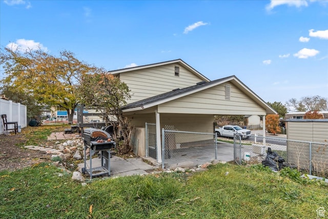 rear view of property featuring a carport