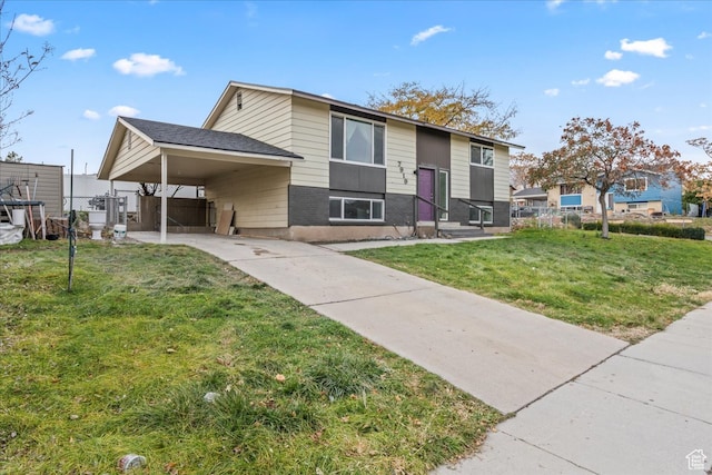raised ranch with a carport and a front lawn