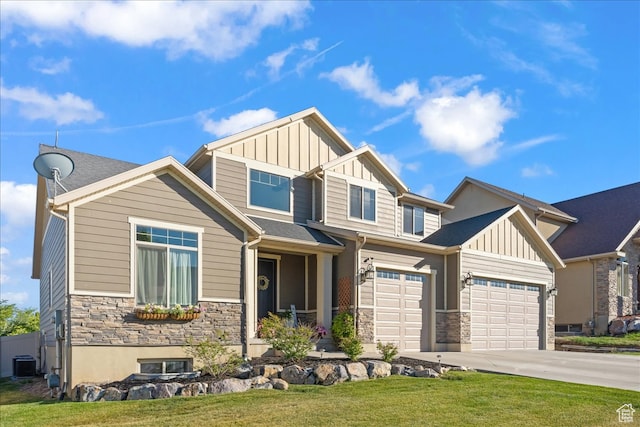 craftsman-style house with a garage, central air condition unit, and a front yard