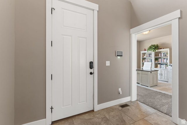 view of carpeted foyer