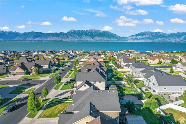 bird's eye view with a water and mountain view