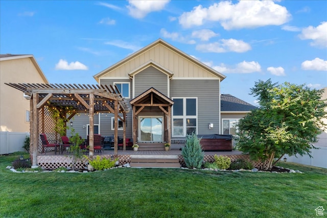 view of front of home featuring a pergola, a hot tub, a front lawn, and a deck
