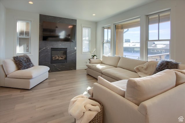 11687 N Shoreline Dr, Hideout, UT 84036 - living room featuring light wood-type flooring and a high end fireplace