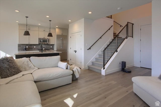 11687 N Shoreline Dr, Hideout, UT 84036 - living room with light wood-type flooring and sink