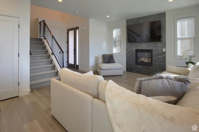 11687 N Shoreline Dr, Hideout, UT 84036 - living room featuring a fireplace and light hardwood / wood-style flooring