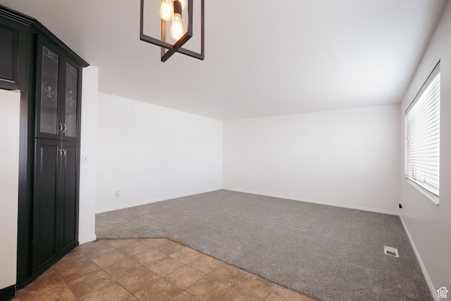 empty room featuring light colored carpet