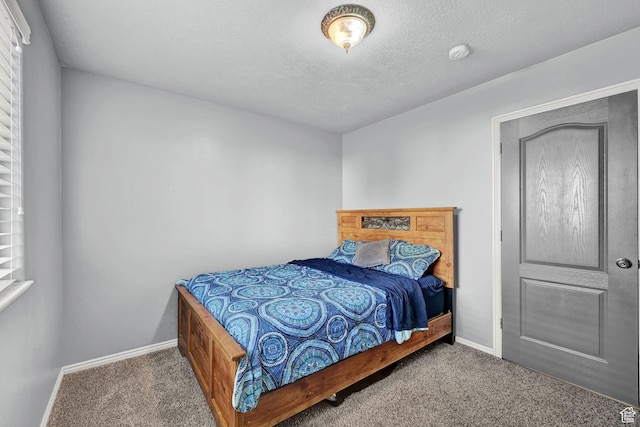 10877 N Wallace Ln E, Tremonton, UT 84337 - carpeted bedroom featuring baseboards and a textured ceiling