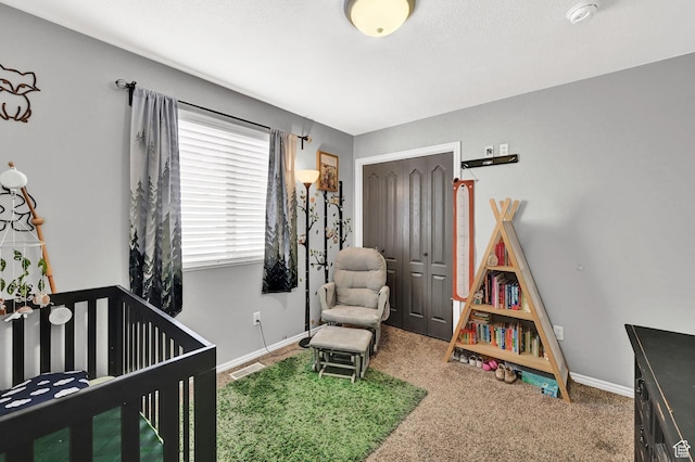 10877 N Wallace Ln E, Tremonton, UT 84337 - carpeted bedroom with a closet, baseboards, and a crib
