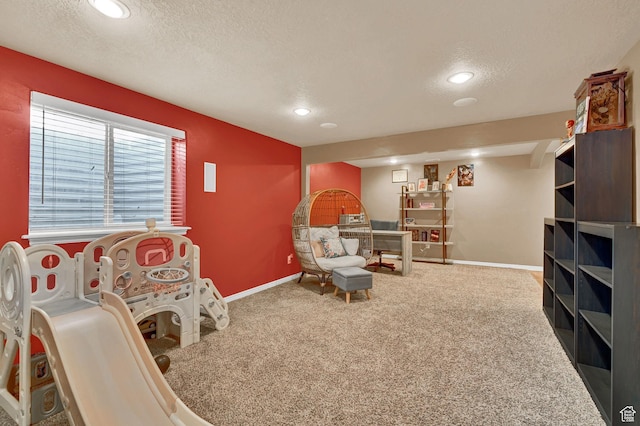 10877 N Wallace Ln E, Tremonton, UT 84337 - living area featuring carpet, a textured ceiling, baseboards, and recessed lighting
