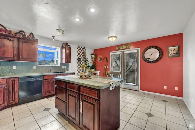 10877 N Wallace Ln E, Tremonton, UT 84337 - kitchen featuring black dishwasher, a sink, light tile patterned floors, a textured ceiling, and a center island