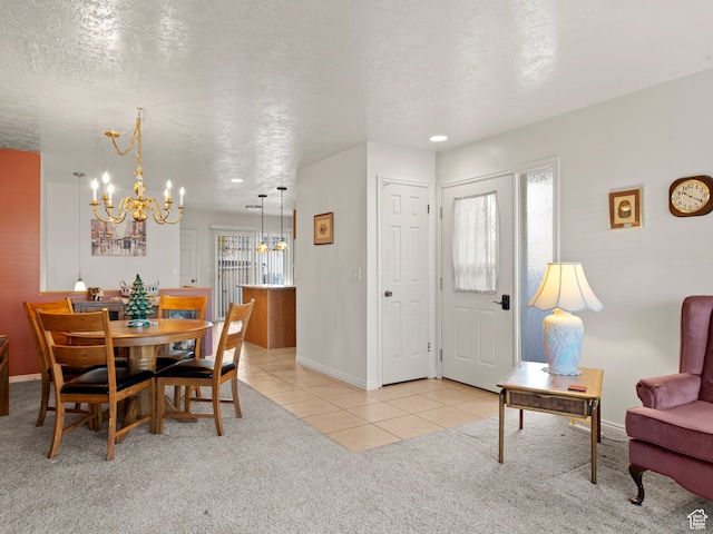 3689 W 5215 S, Taylorsville, UT 84129 - dining space with an inviting chandelier, baseboards, a textured ceiling, light tile patterned flooring, and light carpet