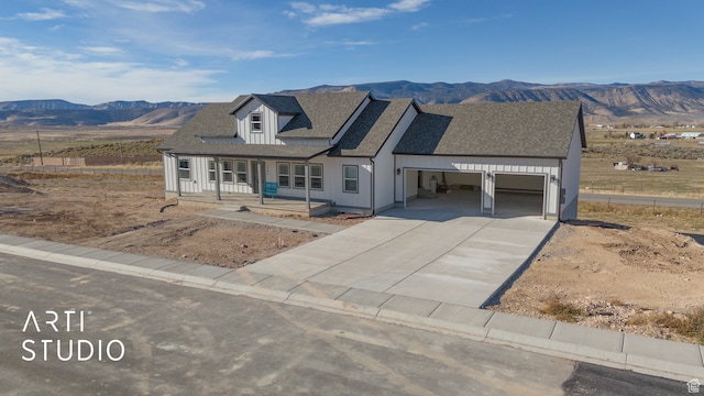 1242 S 500 W Unit 07, Manti, UT 84642 - view of front of home with a garage, a mountain view, and covered porch