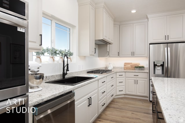 1242 S 500 W Unit 07, Manti, UT 84642 - kitchen with stainless steel appliances, sink, white cabinets, and light stone counters