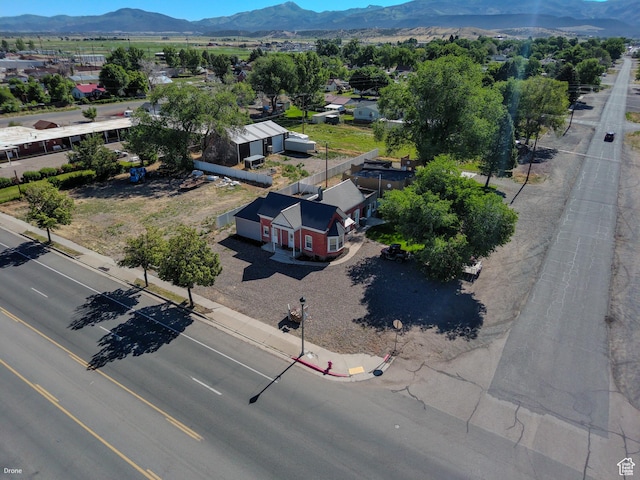 410 N Main St, Beaver, UT 84713 - aerial view of property and surrounding area featuring a mountainous background