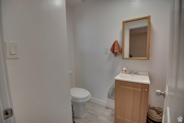 410 N Main St, Beaver, UT 84713 - half bath featuring vanity and wood finished floors