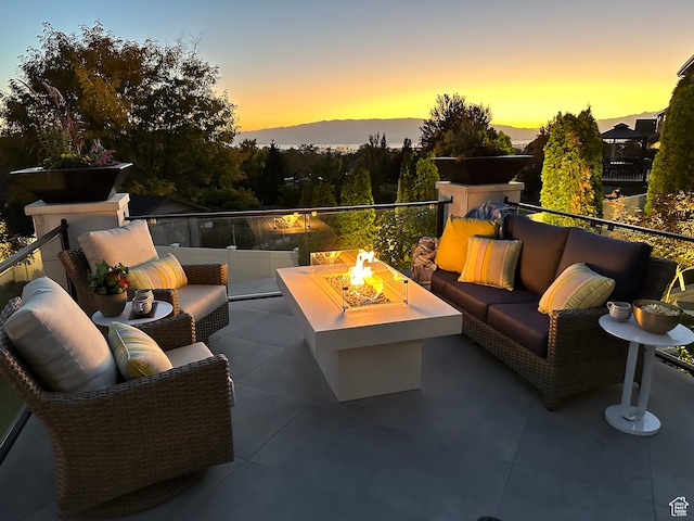 106 E 710 N, Lindon, UT 84042 - patio terrace at dusk featuring an outdoor living space with a fire pit