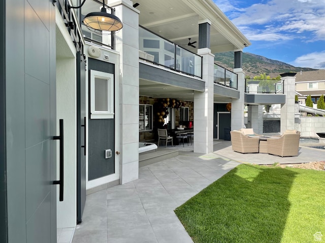 106 E 710 N, Lindon, UT 84042 - view of patio / terrace with a mountain view, a balcony, ceiling fan, and an outdoor hangout area
