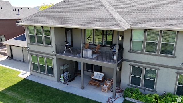 2195 S 1600 W, Richfield, UT 84701 - back of house featuring a balcony, stucco siding, a patio area, roof with shingles, and a yard