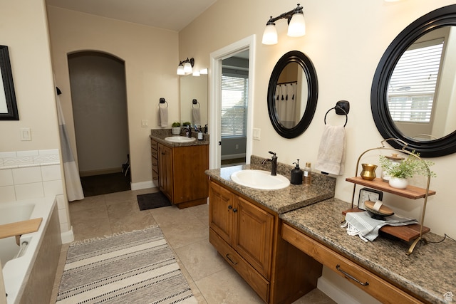 2195 S 1600 W, Richfield, UT 84701 - bathroom with tile patterned flooring, vanity, and a relaxing tiled tub