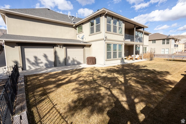 2195 S 1600 W, Richfield, UT 84701 - back of property featuring a balcony, a garage, and a trampoline