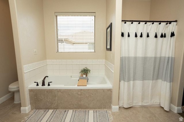 2195 S 1600 W, Richfield, UT 84701 - full bath featuring tile patterned flooring, toilet, a garden tub, baseboards, and a shower with curtain