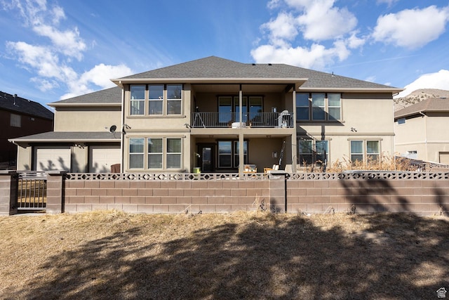 2195 S 1600 W, Richfield, UT 84701 - rear view of property with stucco siding, a balcony, and roof with shingles