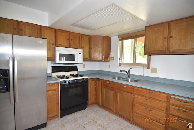 154 W 200 N, Mona, UT 84645 - kitchen featuring stainless steel refrigerator with ice dispenser, black gas range oven, white microwave, brown cabinets, and light tile patterned floors