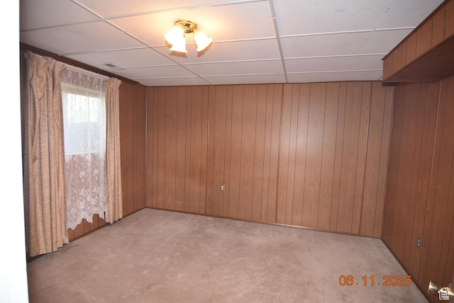 154 W 200 N, Mona, UT 84645 - empty room featuring a paneled ceiling, light colored carpet, and wood walls