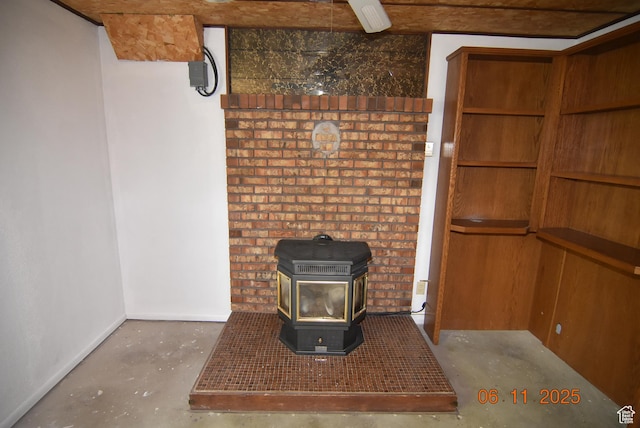 154 W 200 N, Mona, UT 84645 - detailed view of unfinished concrete floors and a wood stove