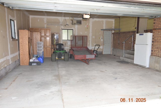 154 W 200 N, Mona, UT 84645 - garage with freestanding refrigerator and a garage door opener