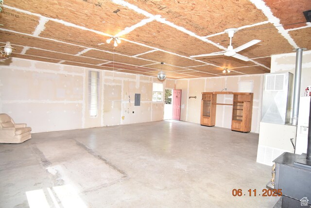 154 W 200 N, Mona, UT 84645 - garage featuring a wood stove and electric panel
