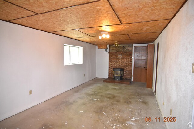 154 W 200 N, Mona, UT 84645 - basement featuring a wood stove and a ceiling fan