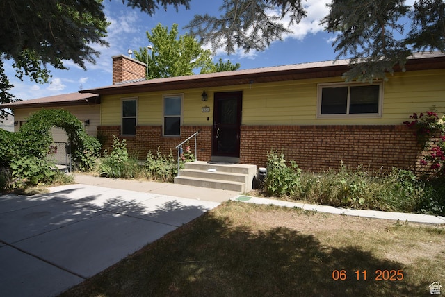 154 W 200 N, Mona, UT 84645 - ranch-style house featuring a chimney and brick siding