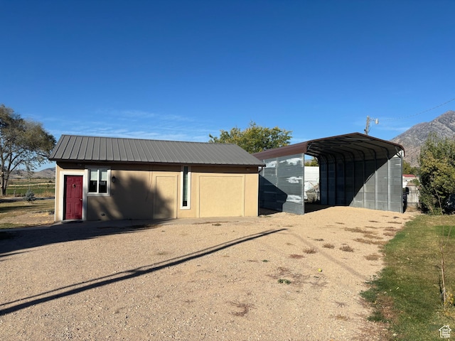 154 W 200 N, Mona, UT 84645 - garage with a detached carport, driveway, and a mountain view