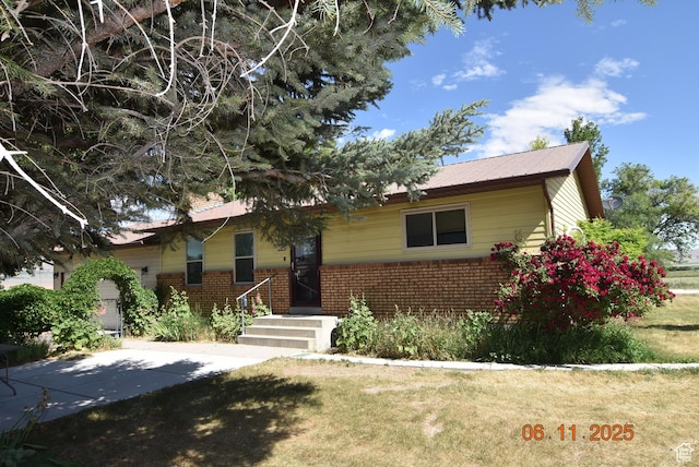 154 W 200 N, Mona, UT 84645 - ranch-style home featuring brick siding and a front yard