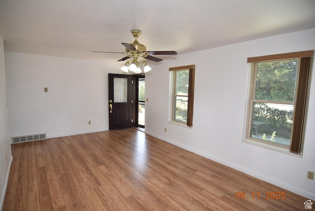 154 W 200 N, Mona, UT 84645 - empty room featuring plenty of natural light, wood finished floors, and a ceiling fan