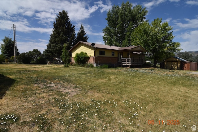 154 W 200 N, Mona, UT 84645 - view of green lawn with a storage shed