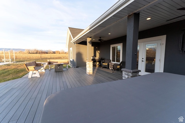 5361 N 4500 E, Roosevelt, UT 84066 - wooden deck featuring outdoor dining area, a fire pit, and ceiling fan