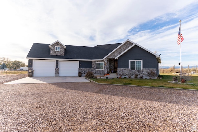 5361 N 4500 E, Roosevelt, UT 84066 - view of front of property with stone siding, concrete driveway, an attached garage, and a front yard