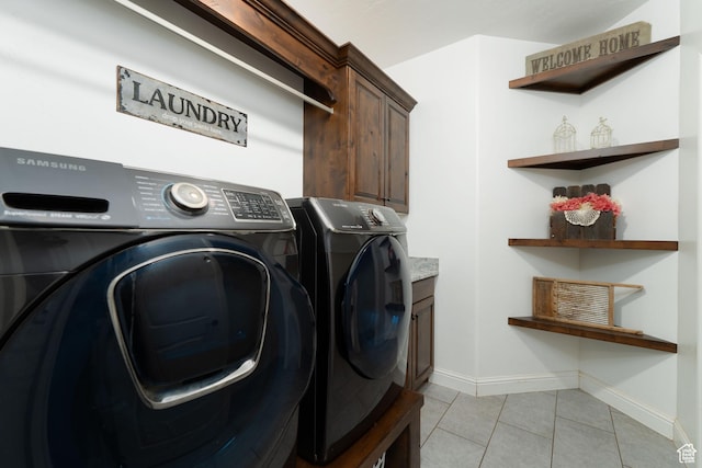 5361 N 4500 E, Roosevelt, UT 84066 - laundry area featuring washing machine and dryer, light tile patterned floors, cabinet space, and baseboards