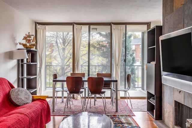 241 N Vine St Unit 205W, Salt Lake City, UT 84103 - dining room featuring wood finished floors and expansive windows