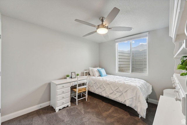 2118 N Snowy Crane Dr, Clinton, UT 84015 - bedroom with dark carpet, baseboards, and a ceiling fan