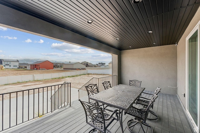 2118 N Snowy Crane Dr, Clinton, UT 84015 - wooden terrace with outdoor dining space and a residential view