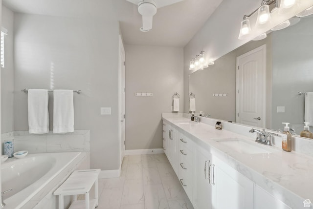2118 N Snowy Crane Dr, Clinton, UT 84015 - bathroom with marble look tile flooring, double vanity, a garden tub, and baseboards