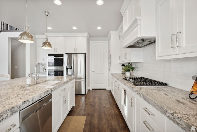 2118 N Snowy Crane Dr, Clinton, UT 84015 - kitchen featuring appliances with stainless steel finishes, a sink, custom range hood, white cabinets, and recessed lighting