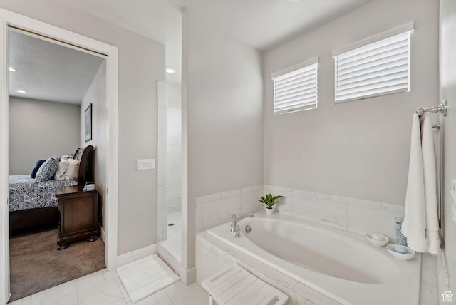 2118 N Snowy Crane Dr, Clinton, UT 84015 - bathroom with a bath, marble finish flooring, connected bathroom, baseboards, and a walk in shower
