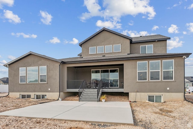 2118 N Snowy Crane Dr, Clinton, UT 84015 - rear view of house with stucco siding and a patio area