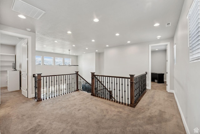 2118 N Snowy Crane Dr, Clinton, UT 84015 - corridor with an upstairs landing, carpet flooring, recessed lighting, and baseboards