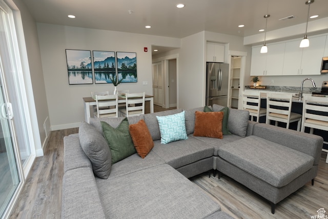 living room with light hardwood / wood-style floors