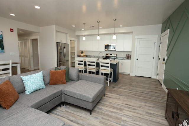 living room with light hardwood / wood-style floors